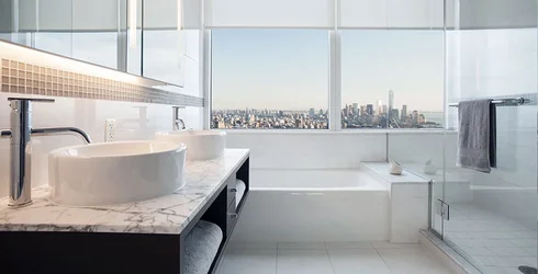 https://d206qjx0felmzj.cloudfront.net/unit-images/bcad8d40-7f31-41ad-a659-975123c95f43/s/luxury-apartments-bath-nyc-4_Q_kdm.webp