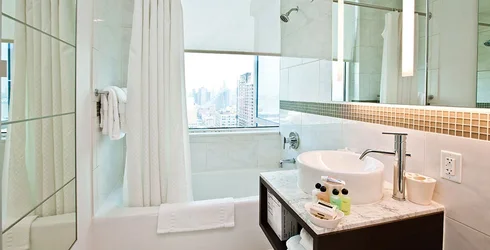 https://d206qjx0felmzj.cloudfront.net/unit-images/bcad8d40-7f31-41ad-a659-975123c95f43/s/luxury-apartments-shower-nyc-3334_m5h_.webp